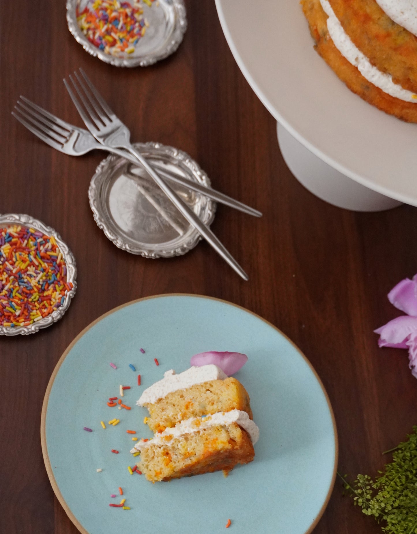 Batta confetti cake slice made with all natural cake mix, topped with Batta toasted sugar vanilla frosting