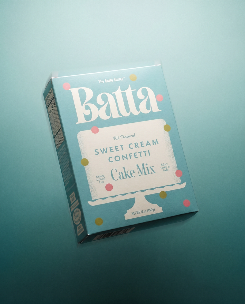 Box of Batta Sweet Cream Confetti Cake Mix on a teal background. Batta all-natural cake and frosting mixes - gourmet gifts for bakers, moms, foodies